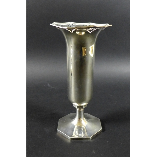 24 - An Edwardian silver spill vase, with pierced rim decoration, raised upon a hexagonal base, Walker & ... 