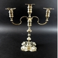 An Elizabeth II silver candelabrum, in the Georgian style, twin scrolling branches issuing from the ... 