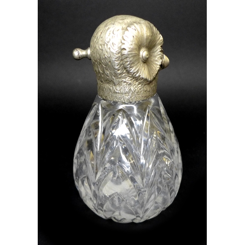 41 - A Victorian silver novelty atomiser, modelled as an owl with chased silver head and cut glass conica... 