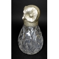 A Victorian silver novelty atomiser, modelled as an owl with chased silver head and cut glass conica... 