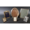 A group of six silver photograph frames, the largest of rectangular form, 23 by 17.3cm, Charles S Gr... 