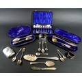 A group of silver items, comprising a Victorian berry spoon, Walker & Hall, Sheffield 1897, a cased ... 