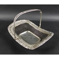 A George III silver cake basket, of rectangular form with open wirework body, applied floral relief ... 