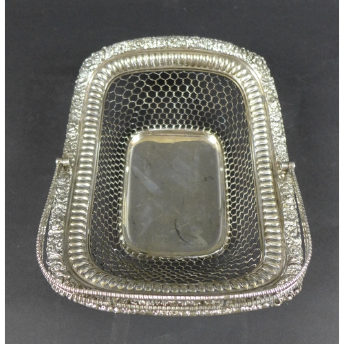 99 - A George III silver cake basket, of rectangular form with open wirework body, applied floral relief ... 