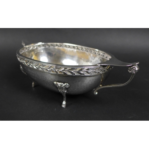 53 - A pair of silver George V twin handled oval form planished bowls, with presentation inscription to '... 