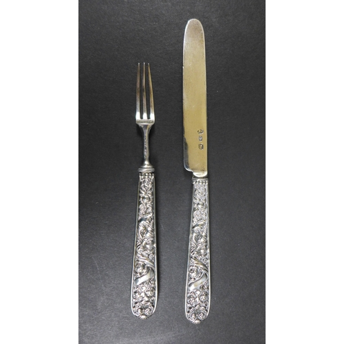 7 - A Georgian small silver butter and pickle fork, with filled foliate handles, both inscribed 'JP 1825... 