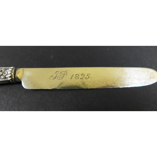 7 - A Georgian small silver butter and pickle fork, with filled foliate handles, both inscribed 'JP 1825... 