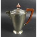 An Elizabeth II silver coffee pot, with stepped circular lid, bakelite handle and finial, terminatin... 