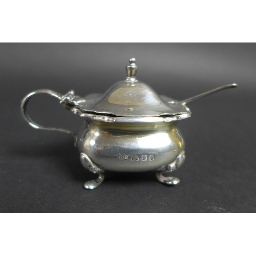 51 - A group of nine silver items, comprising a pair of octagonal form pepper pots, James Deakin & Sons, ... 