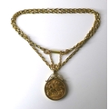 A George V gold sovereign, 1913, in a 9ct gold mount and 9ct gold chain necklace, 50cm long, 16.2g t... 
