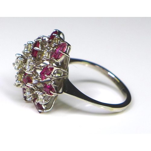 305 - Private collection-Vintage and Modern design rings: A diamond and ruby dress ring of asymmetrical cl... 