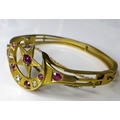 A Victorian 15ct gold ruby and diamond bangle with crescent moon and five pointed star design, compo... 