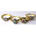 A group of four gold rings, including an Art Deco style 18ct gold and palladium ring, size N, 2.7g, ... 