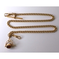 A 19th century 9ct gold Albert chain with three sided swivel fob, featuring a carnelian, onyx and je... 