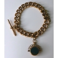 A 9ct gold chain bracelet converted from an Albert chain with a two sided swivel fob, chain length 1... 