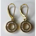 A pair of 9ct gold and diamond drop earrings of ring design, each set with approximately 24 baguette... 