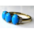 A 9ct gold three stone turquoise and diamond ring, the three oval turquoise stones each of approxima... 