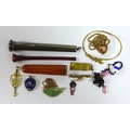 A group of jewellery and objects of vertu, comprising a cherry amber and gold mounted cigarette hold... 