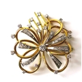 A French diamond, 18ct yellow and white gold brooch, formed as a flower, with hollow wire petals, ce... 