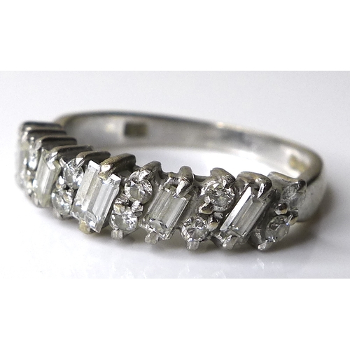 313 - An 18ct white gold and diamond ring, five baguette cut stones, each 4 by 2mm, set alternately with s... 