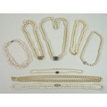 A group of cultured pearl and faux pearl necklaces, comprising a double strand, each 8mm, with silve... 