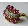 A 14ct gold, diamond and ruby Faberge ‘Firebird’ ring, by Franklin Mint, the six graduated brilliant... 