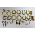A group of gold earrings, comprising a pair of 14ct gold hoop earrings, 2g, and eight pairs of 9ct g... 