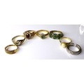 A group of six 9ct gold dress rings, including an emerald and diamond cluster ring, size O, and an e... 