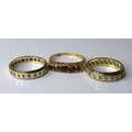 Two 9ct gold wedding bands, each studded with small white stones, size R and size M, together with a... 