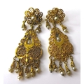 A pair of 1930s Indian 9ct gold earrings with seed pearl drops, very fine pierced decoration, each e... 