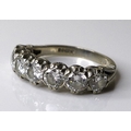 An 18ct white gold and diamond seven stone ring, each diamond approximately 0.3ct and 4mm diameter, ... 