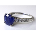 A 14ct white gold and sapphire solitaire dress ring, the cushion cut deep cornflower blue stone of a... 