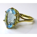An 18ct gold and aquamarine solitaire ring, the pale blue aquamarine of approximately 4ct, 11.8 by 9... 