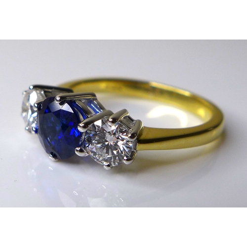 337 - An 18ct gold, diamond and sapphire three stone ring,  with central sapphire of approximately 1.2ct, ... 