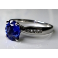 An 18ct white gold, sapphire and diamond dress ring, the deep cornflower blue sapphire of approximat... 