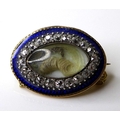 A mid 19th century 15ct gold mourning brooch of oval form, the central marquise surrounded by twenty... 