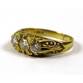 A 18ct gold and diamond three stone ring, each stone approximately 0.13ct, 3.54mm diameter, size L, ... 