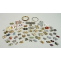 A quantity of costume jewellery, including a large collection of clip on earrings of varying sizes a... 