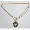A 9ct gold, emerald and diamond heart shaped pendant, 2cm long, on a 9ct gold chain, 51cm long, 2.8g... 