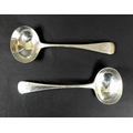 A pair of Victorian silver sauce ladles, Old English pattern, armorial engraved terminals, Holland, ... 