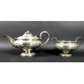 A Regency George IV silver teapot and twin handled sugar bowl, of compressed ovoid form raised on a ... 