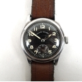 A German WWII military issue Revue-Sport gentleman's wristwatch, the circular black dial with lumino... 
