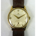 An Omega 9ct gold cased gentleman's wristwatch, circa 1955, model 13322, circular silvered dial with... 