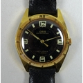 A vintage Oris gold plated gentleman's wristwatch, circular black dial, stylised Arabic cardinal num... 