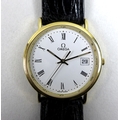 An Omega 18k gold cased gentleman's wristwatch, ref 1061, circular white dial with black Roman numer... 