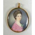 A Georgian gold cased pendant oval portrait miniature, half length, depicting a Georgian lady with b... 
