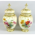 A pair of modern Royal Worcester blush ivory potpourri vases and pierced covers, decorated in ‘Victo... 