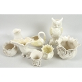 A collection of Belleek vases and pots, including a flowered cache pot, 11cm high, with second black... 