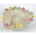 A Belleek four strand heart shaped basket, with ornate flowers to the rim of the basket, applied ban... 