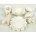 A group of small Belleek wares, comprising a first period custard cup with imbricated surface decora... 